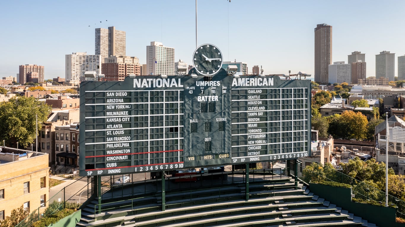 The iconic manual scoreboard at Wrigley Field showing National and American league scores